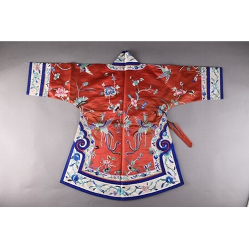 187 - A Chinese silk embroidered child's robe, Qing Dynasty Worked in coloured threads with phoenix birds,... 