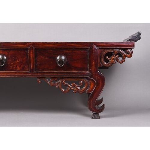 192 - A Chinese lacquered softwood calligraphy table Late Qing Dynasty, the moulded top above three frieze... 