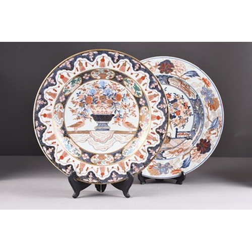 199 - Two Japanese Imari dishes, Edo era Each decorated with a central flower vase, within multiple border... 