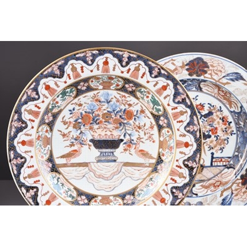 199 - Two Japanese Imari dishes, Edo era Each decorated with a central flower vase, within multiple border... 