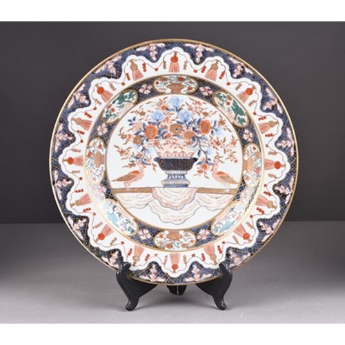 199 - Two Japanese Imari dishes, Edo era Each decorated with a central flower vase, within multiple border... 