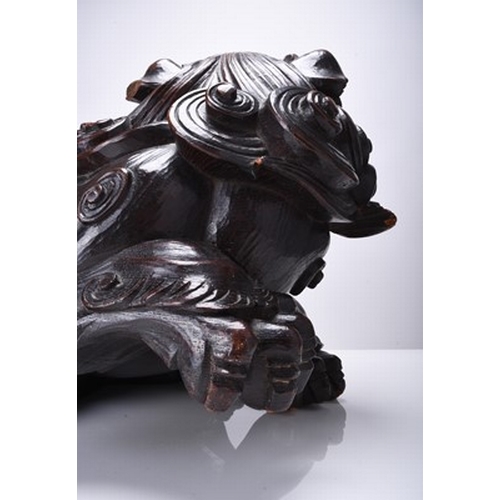 230 - A large Japanese carved wood figure of a komainu, Edo/Meiji era Signed to the underside. 32cm long x... 