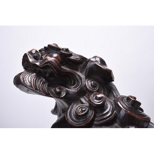 230 - A large Japanese carved wood figure of a komainu, Edo/Meiji era Signed to the underside. 32cm long x... 