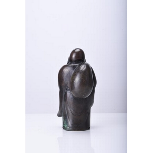 232 - A Japanese bronze figure of Hotei, Meiji era Modelled standing, his robes open at the front, he carr... 