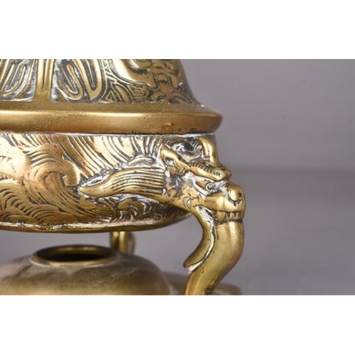 234 - A Japanese bronze candlestick, Meiji era Of three-tiered form and cast with mythical beasts, lotus f... 