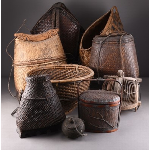 255 - A collection of Indonesian and East Asian baskets, first half 20th century Hand woven in bamboo and ... 