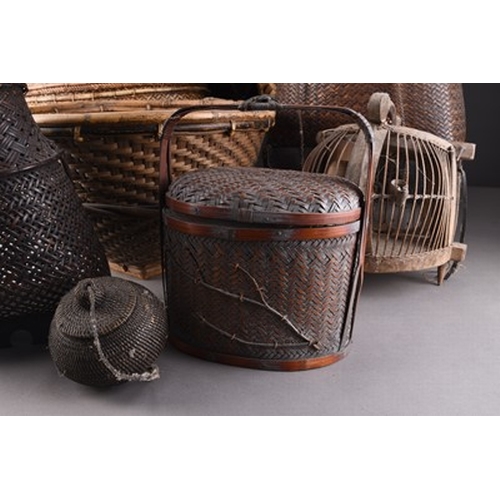 255 - A collection of Indonesian and East Asian baskets, first half 20th century Hand woven in bamboo and ... 