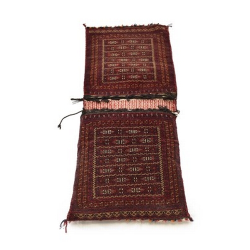 279 - An Oushak runner, 290cm x 84cm, a Caucasian runner, 290cm x 84cm, three various donkey bags and a Bo... 