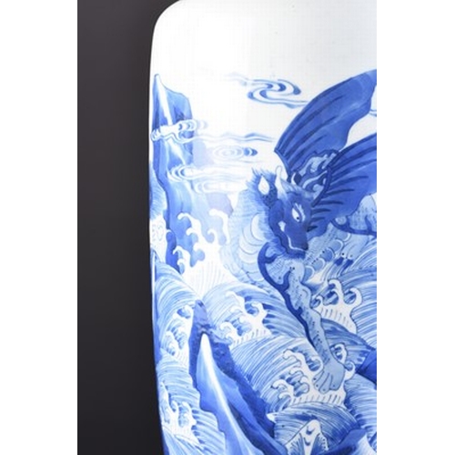 28 - A Chinese blue and white rouleau vase, 19th century Decorated with a scene of Qilin and Pixiu perche... 