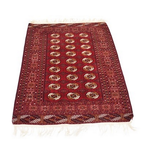 280 - Three Afgham Bokkara pattern rugs, 20th century The first a rich red ground, 187cm x 150cm, the seco... 