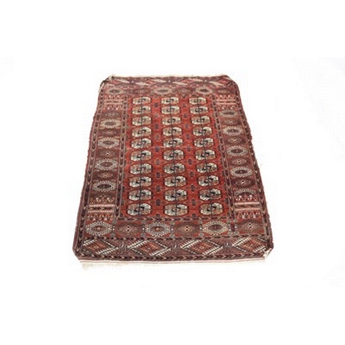 281 - Two Afghan Bokkara pattern rugs, 20th century Both with a rich red ground. 193cm x 128cm and 166cm x... 