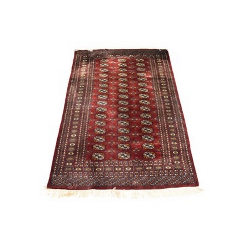 281 - Two Afghan Bokkara pattern rugs, 20th century Both with a rich red ground. 193cm x 128cm and 166cm x... 