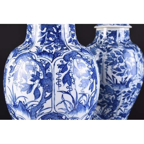 31 - A pair of Chinese transitional blue and white vases and covers, Kangxi Of ovoid form with domed cove... 