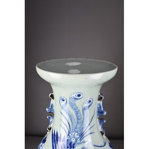 36 - A large Chinese blue and white celadon vase, 19th century Of ovoid form with twin lion-dog handles, ... 