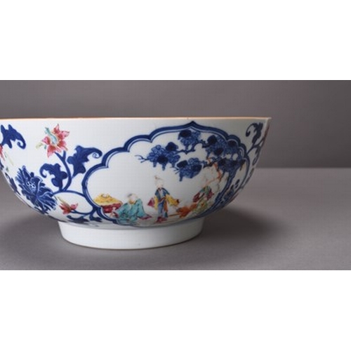 38 - A Chinese blue and white famille rose punch bowl, 18th century Of rounded form and decorated with th... 