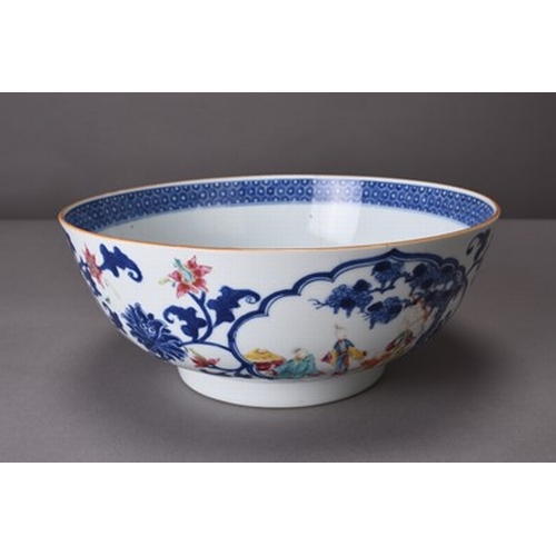 38 - A Chinese blue and white famille rose punch bowl, 18th century Of rounded form and decorated with th... 