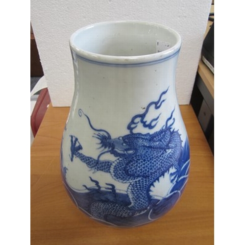 43 - A Chinese blue and white dragon vase Kangxi six-character mark but 19th century Of ovoid form with d... 