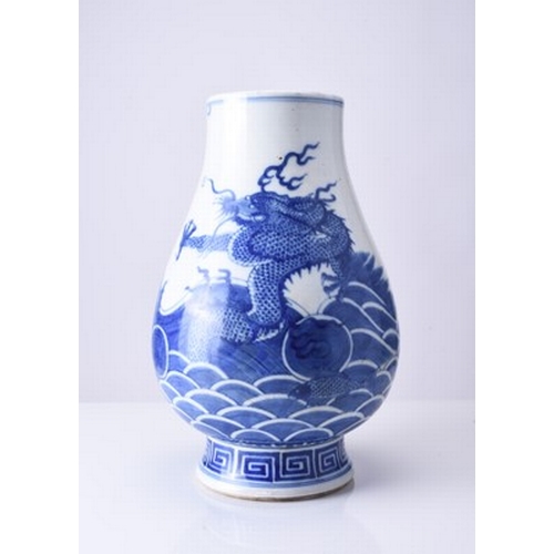 43 - A Chinese blue and white dragon vase Kangxi six-character mark but 19th century Of ovoid form with d... 