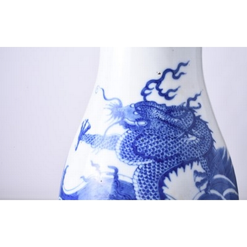 43 - A Chinese blue and white dragon vase Kangxi six-character mark but 19th century Of ovoid form with d... 