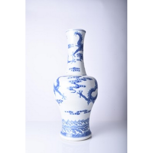 45 - A Chinese blue and white dragon vase, Jiaqing Of baluster form and decorated with three dragons chas... 