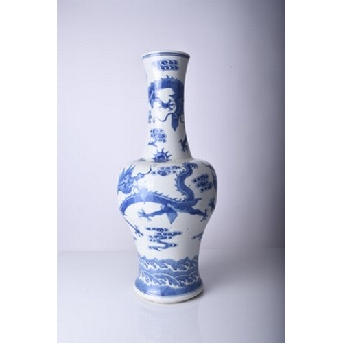 45 - A Chinese blue and white dragon vase, Jiaqing Of baluster form and decorated with three dragons chas... 