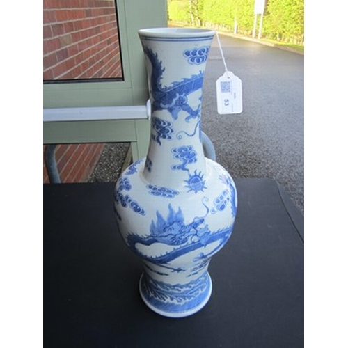 45 - A Chinese blue and white dragon vase, Jiaqing Of baluster form and decorated with three dragons chas... 