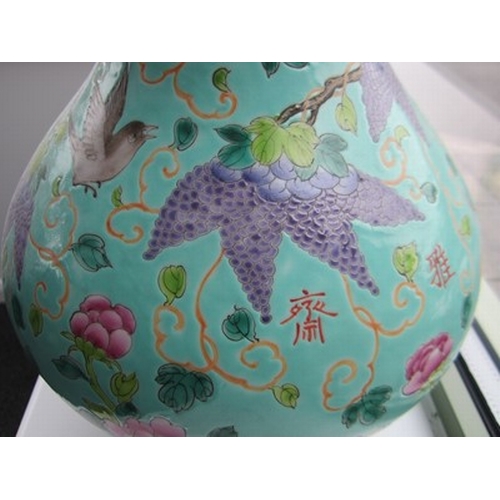 52 - A Chinese Dayazhai porcelain bottle vase, Guangxu Of pear shape and decorated with birds perched and... 