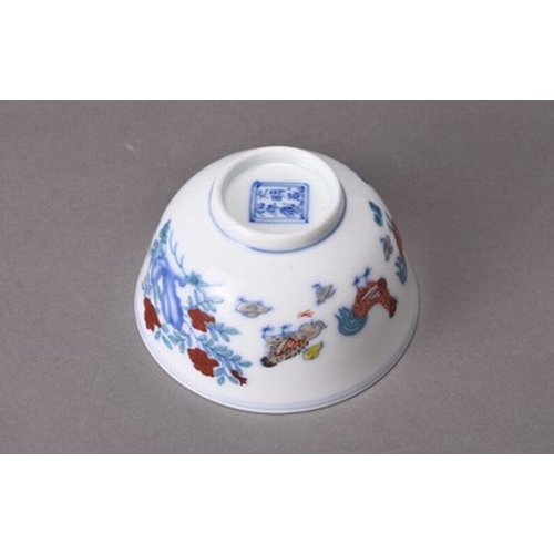 60 - A Chinese Doucai porcelain chicken cup Chenghua six-character mark but later Of conical form and dec... 