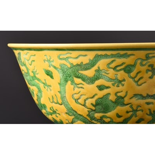 69 - A Chinese yellow ground dragon bowl, Jiajing six-character mark but later Probably 19th century, of ... 