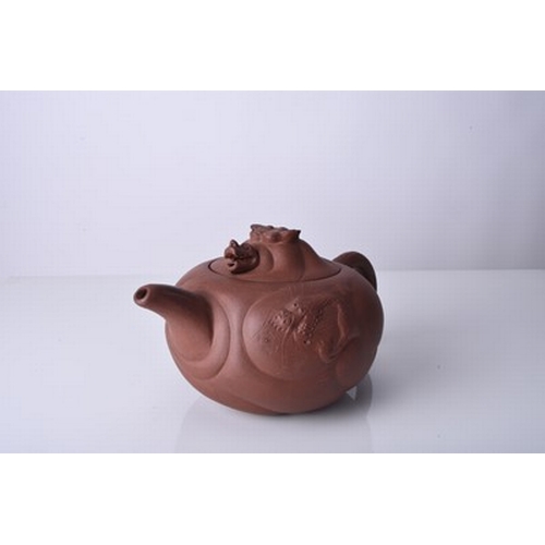 88 - Three Chinese Yixing teapots and covers, 20th century All of compressed ovoid form, the first modell... 