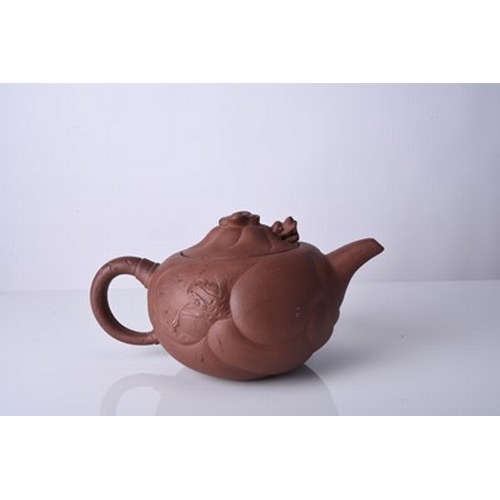 88 - Three Chinese Yixing teapots and covers, 20th century All of compressed ovoid form, the first modell... 