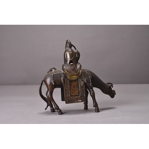 95 - A Chinese bronze figure of a lohan riding a horse, possibly Ming Dynasty 15.5cm high