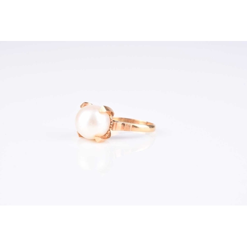 107 - A single cultured pearl ring, size J, stamped 'k18', weight approx 4.1g