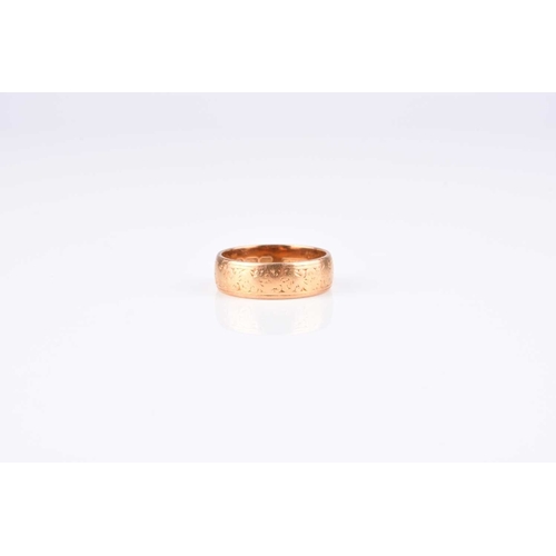 110 - A 22ct gold wedding band, with engraved decoration, ring size J 1/2, hallmarked London 1963, weight ... 