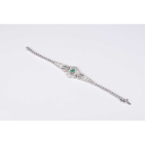 125 - An emerald and diamond bracelet, designed as a single oval mixed cut emerald claw set within pave di... 