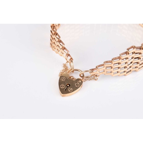 128 - A 9ct gold six bar gate link bracelet, with heart shaped padlock clasp, hallmarked London 1977, weig... 