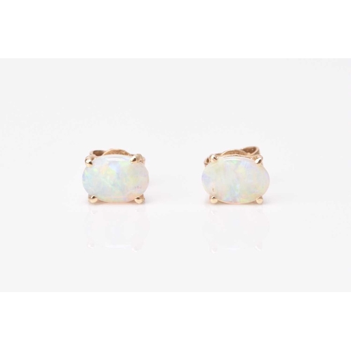 176 - A pair of 9ct gold sapphire and diamond cluster stud earrings, each designed as a central diamond wi... 