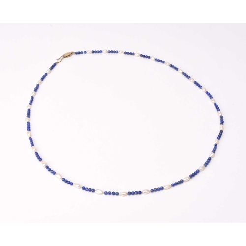 182 - A single strand lapis lazuli and freshwater pearl necklace, yellow metal clasp stamped 585 J K a, ... 