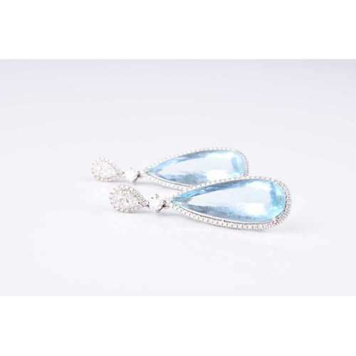 184 - A pair of 18ct white gold aquamarine and diamond ear pendants, each designed as a faceted pear cut a... 