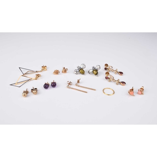 185 - A collection of earrings, comprising; a pair of garnet and seed pearl drops, stamped '9ct', a pair o... 