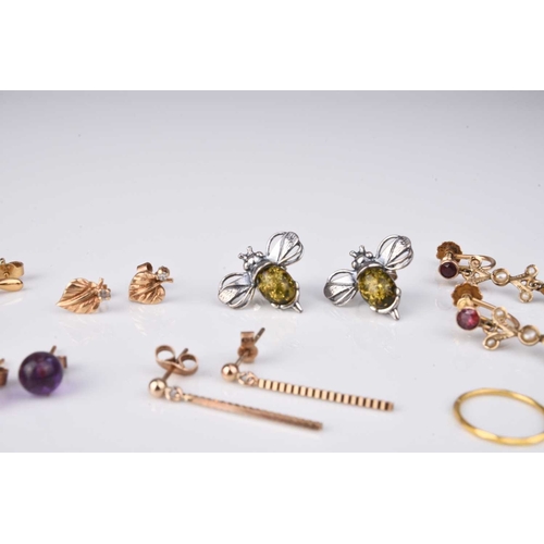 185 - A collection of earrings, comprising; a pair of garnet and seed pearl drops, stamped '9ct', a pair o... 