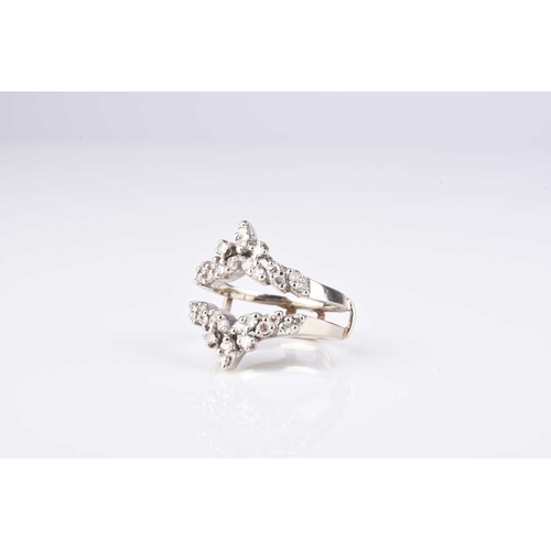 187 - A diamond set double herringbone ring, the round faceted diamond claw set in white metal to white me... 