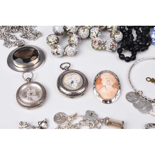 193 - A small collection of jewellery and costume jewellery, to include; a silver charm bracelet, a white ... 