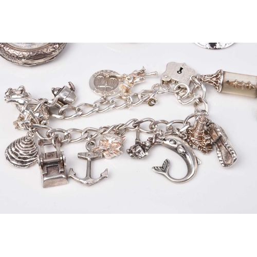 193 - A small collection of jewellery and costume jewellery, to include; a silver charm bracelet, a white ... 