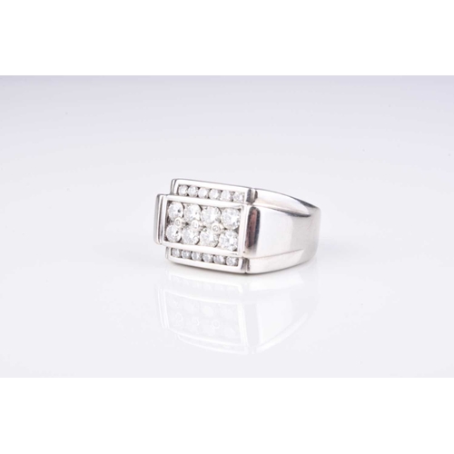 206 - A Gentleman's diamond set panel ring, the graduated brilliant cut diamonds channel and collet set in... 