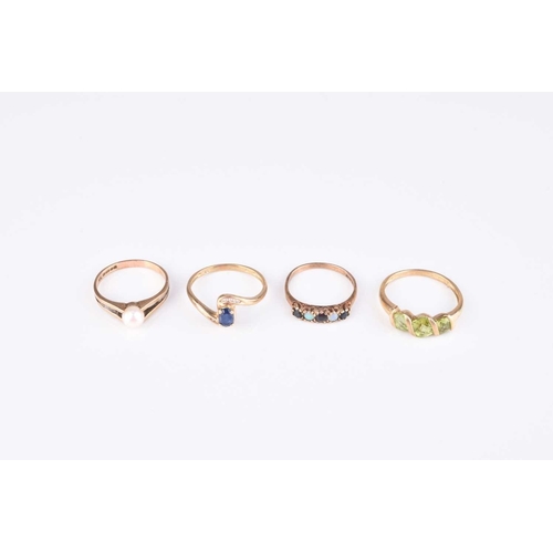 224 - A collection of four 9ct gold stone set rings, comprising; a graduated three stone peridot example, ... 