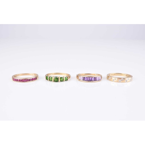 225 - A collection of four 9ct gold stone set rings, comprising; an amethyst set band, size V, a ruby set ... 