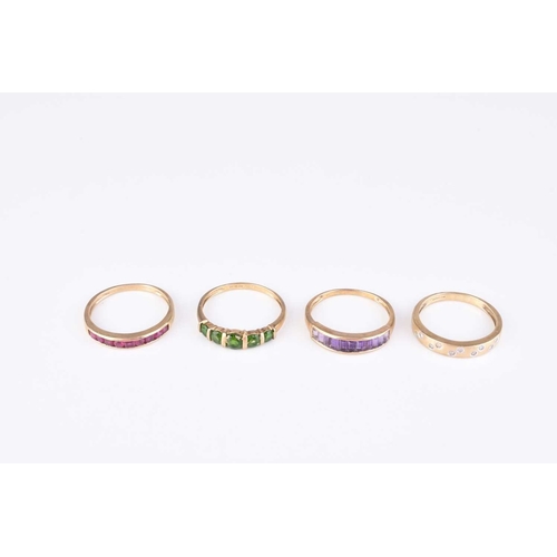 225 - A collection of four 9ct gold stone set rings, comprising; an amethyst set band, size V, a ruby set ... 