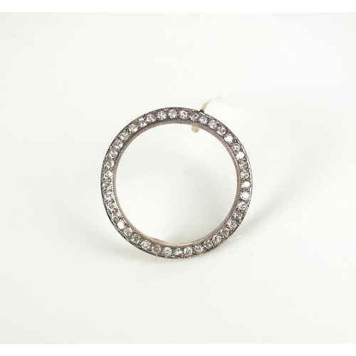 226 - An old cut diamond set circular brooch, designed as a ring of old cut diamonds claw set in white met... 