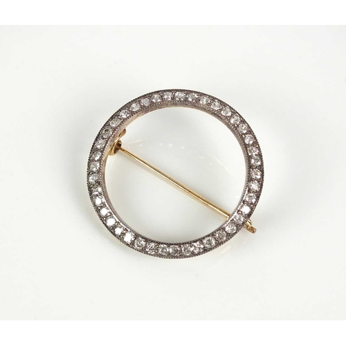 226 - An old cut diamond set circular brooch, designed as a ring of old cut diamonds claw set in white met... 